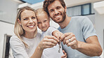 Portrait, family and keys for new home, happiness and excited for achievement, loving and real estate property. Face, mother and father with daughter, buying and moving into house and happy together