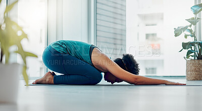 Buy stock photo Yoga, child pose and wellness exercise of a black woman in a gym or health studio for pilates. Meditation, peace and relax female person doing a balance, zen and chakra workout for self care