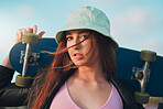 Summer, skateboard and portrait of woman in city for freedom, sports and relax lifestyle. Training, fitness and sunset with girl walking in urban town enjoying adventure, wellness and energy vacation