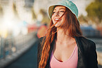 Travel, happy and mockup with a woman in the city, walking outdoor as a tourist on a summer day. Thinking, freedom and flare with an attractive young female traveler taking a walk for tourism