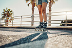 Hobby, ground and legs of a woman on rollerskates for the weekend, fun activity and summer in Miami. Learning, urban and feet of a girl rollerskating on the floor in the urban city for a cool sports