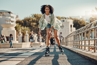 Buy stock photo Exercise, city and black woman roller skating for fitness, health and wellness outdoors. Sports practice, training and portrait of happy female skater in street, having fun and enjoying exercising.