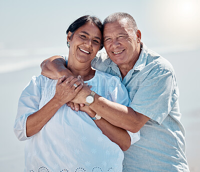 Buy stock photo Retirement couple, portrait and hug at beach for love, care and relax on summer holiday, vacation or date. Happy senior man, woman and embrace at sea for happiness, support and smile in calm sunshine