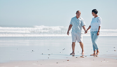 Buy stock photo Senior couple walking on beach for love, care and relax on summer holiday, holding hands with mockup. Happy retirement, man and woman walk at sea for happiness and date with partner at calm ocean