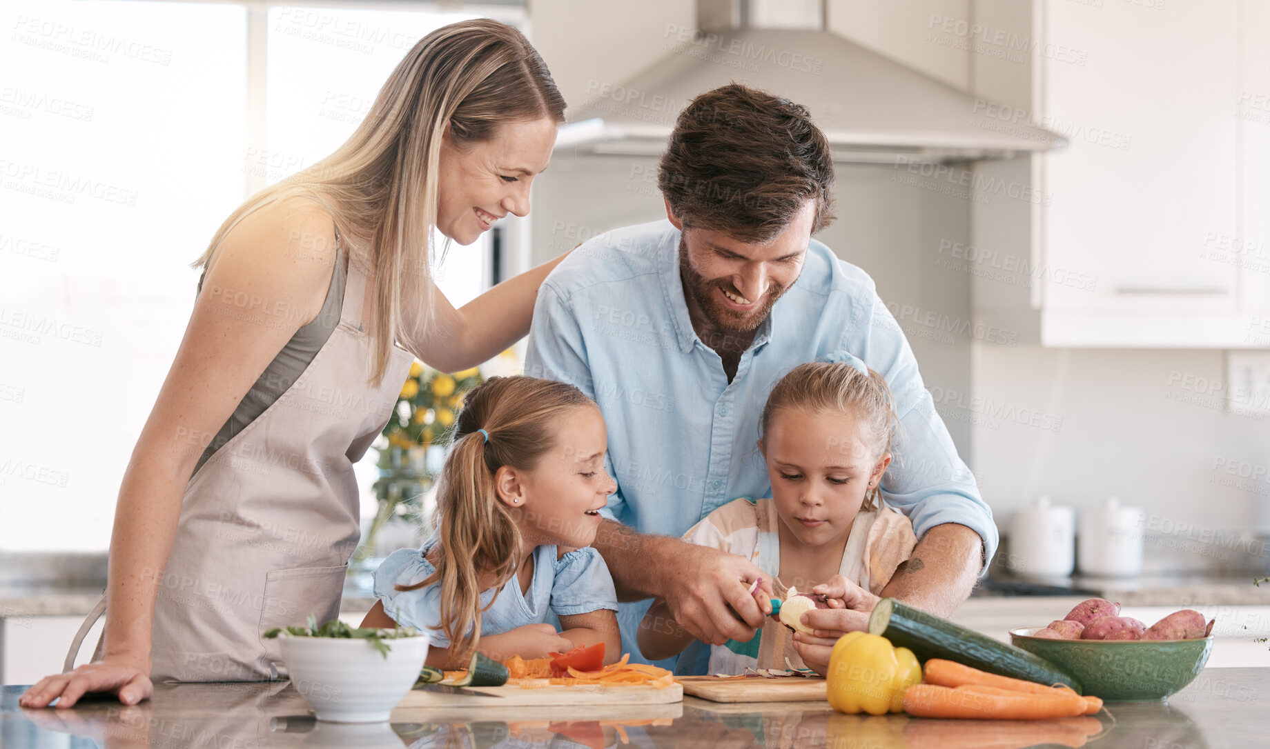 Buy stock photo Kitchen, family and parents with children cooking with vegetables for nutrition, healthy food or meal prep. Chef skills, home and mom, dad and girls learning, teaching and helping peel ingredients