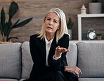 Business therapist, psychology communication and portrait of a mature woman sitting on a couch. Mental wellness worker, psychologist and life coach doing a counseling consultation on a couch