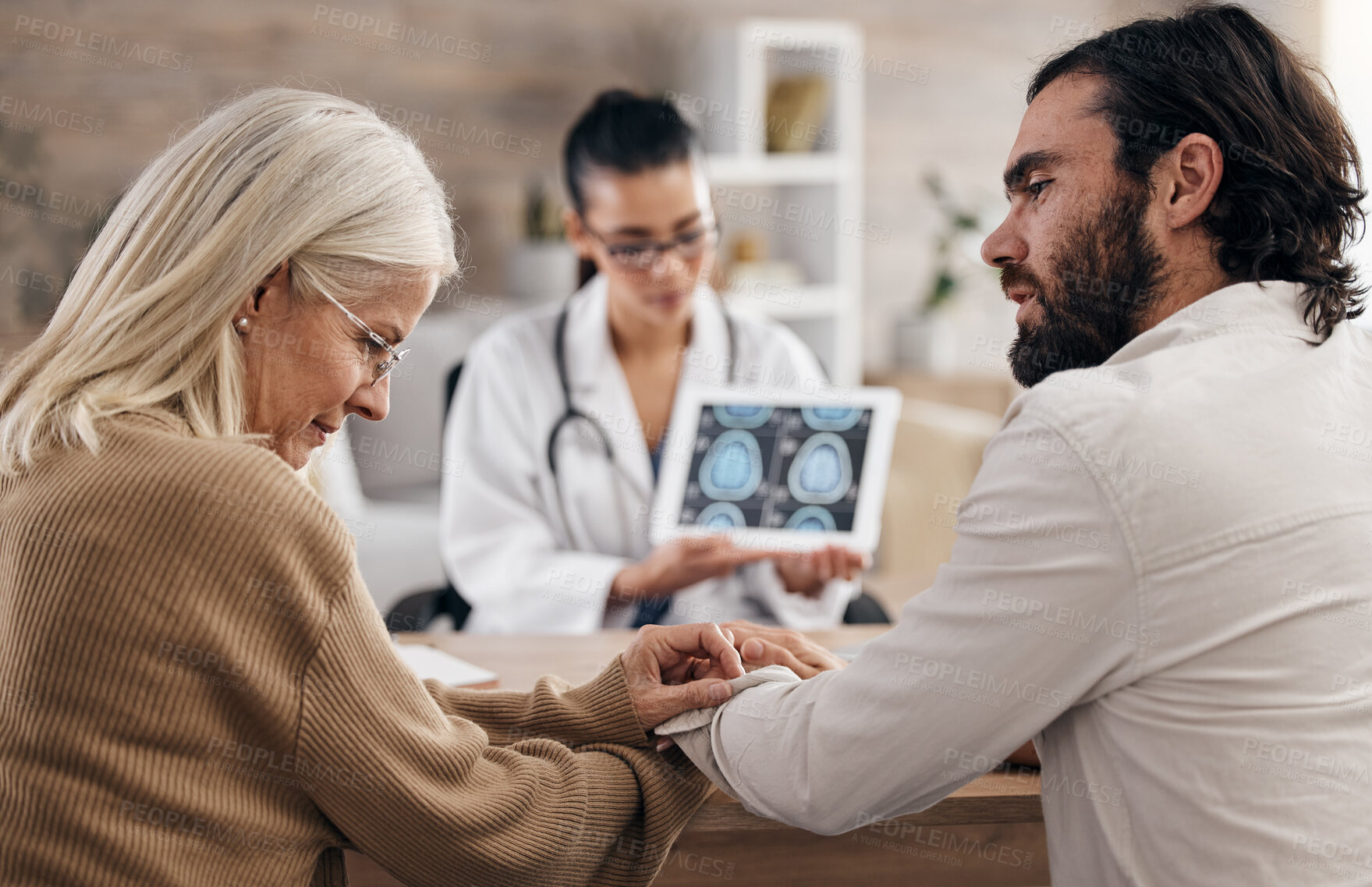 Buy stock photo Brain, scan and doctor with mother and son for mri results or xray diagnosis for cancer on tablet. Healthcare, advice and patient in doctors office consulting on health problem for hospital treatment