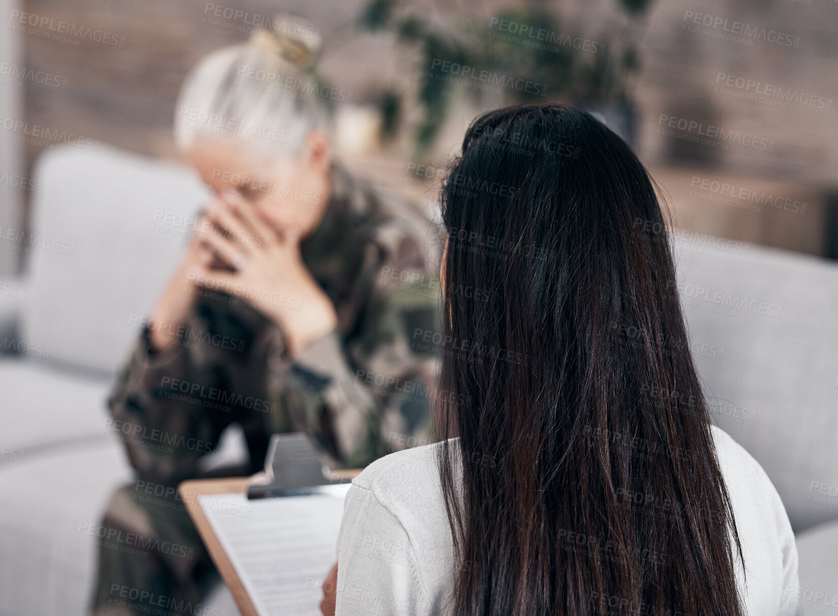 Buy stock photo Soldier woman, psychologist and crying on sofa for therapy, ptsd and help for mental health problem from Ukraine war. Military professional, sad depression and talking on couch after combat 