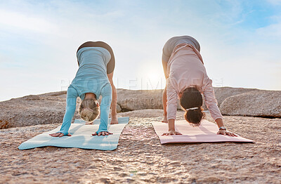 Buy stock photo Yoga, fitness and woman friends exercising on the beach together for mental health or wellness in summer. Exercise, diversity or nature with a female yogi and friend practicing meditation outside