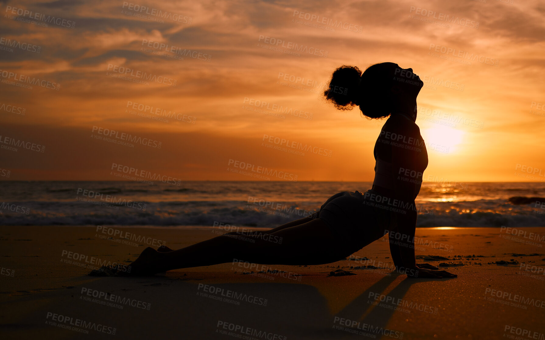 Buy stock photo Sunset yoga, fitness and silhouette of a woman at the beach for mindfulness training at night. Meditation, zen and girl stretching for a pilates pose at the sea in the evening for spiritual exercise