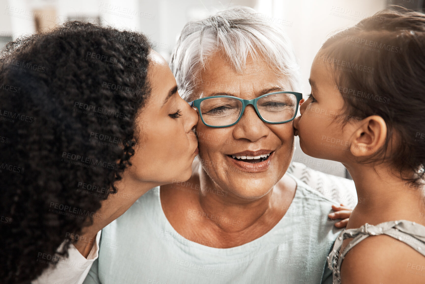 Buy stock photo Kiss, affection and children with grandmother for love, birthday or mothers day. Gratitude, care and an elderly woman with a baby and daughter kissing for appreciation, caring and loving at home