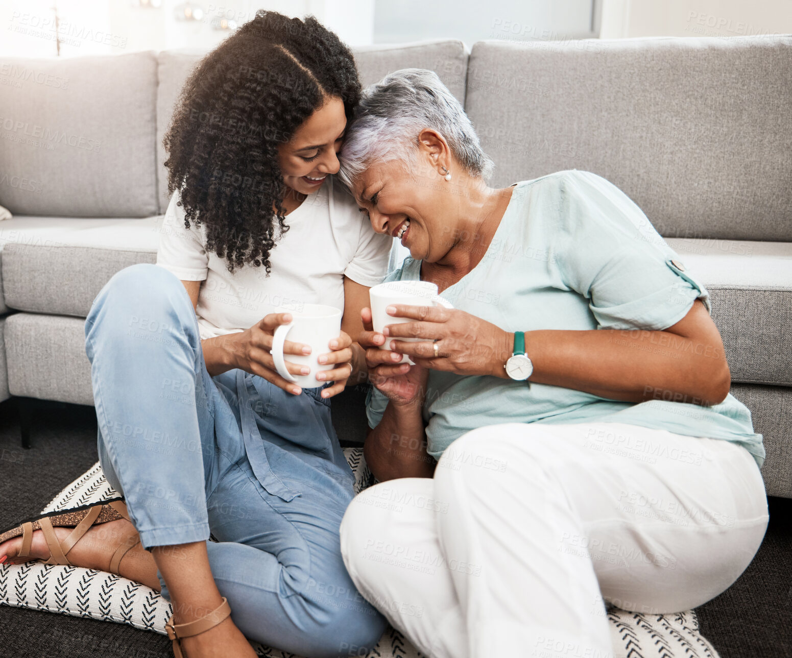 Buy stock photo Relax, laughing and senior mother and daughter with coffee cup for home conversation, talking and bonding together. Black family, people or woman with elderly mom love, tea and living room carpet