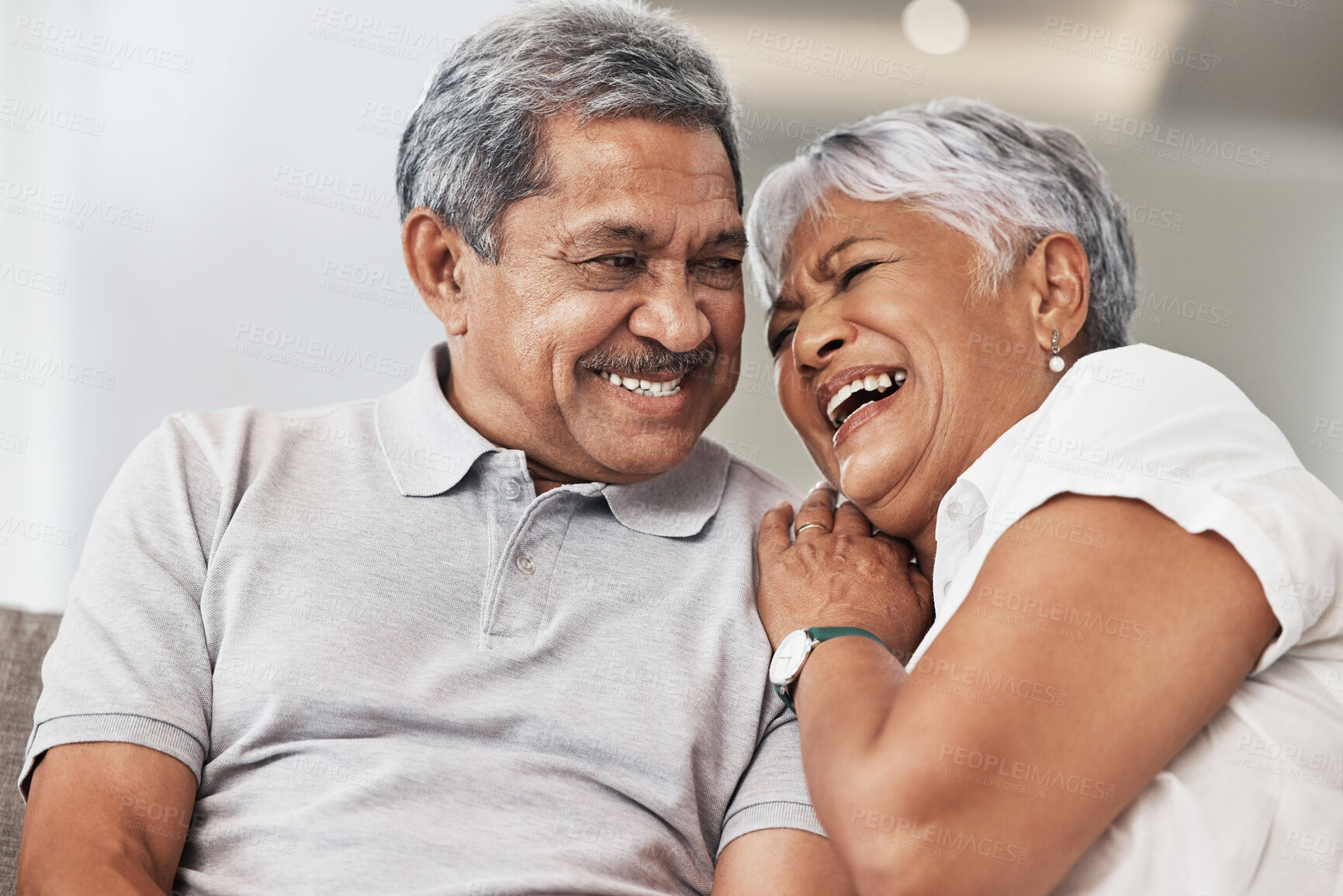 Buy stock photo Love, relax and senior couple laughing at funny joke, enjoy quality time together or bond on home living room sofa. Retirement, smile and elderly man, woman or marriage people happy in house