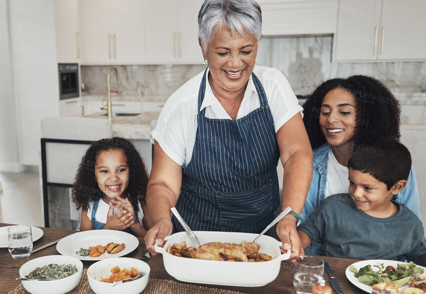 Buy stock photo Grandmother, family home and kids at table for food, lunch or celebration with love, care and happiness. Black people, senior woman and children with dinner, party and happy for bonding in kitchen