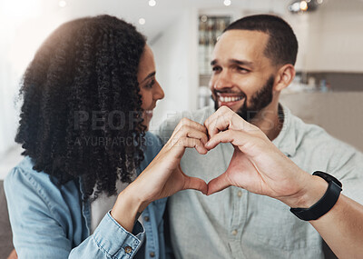 Buy stock photo Love, heart hand sign and happy couple enjoy quality time together, bonding and relax on home living room sofa. Eye contact, emoji gesture and marriage people, man or woman smile in good health