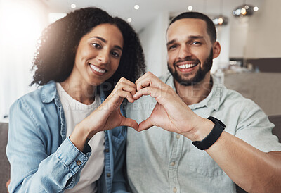 Buy stock photo Love portrait, heart sign or happy couple enjoy quality time together, bonding or relax on home living room sofa. Happiness, emoji gesture and marriage people, man or woman smile in good health