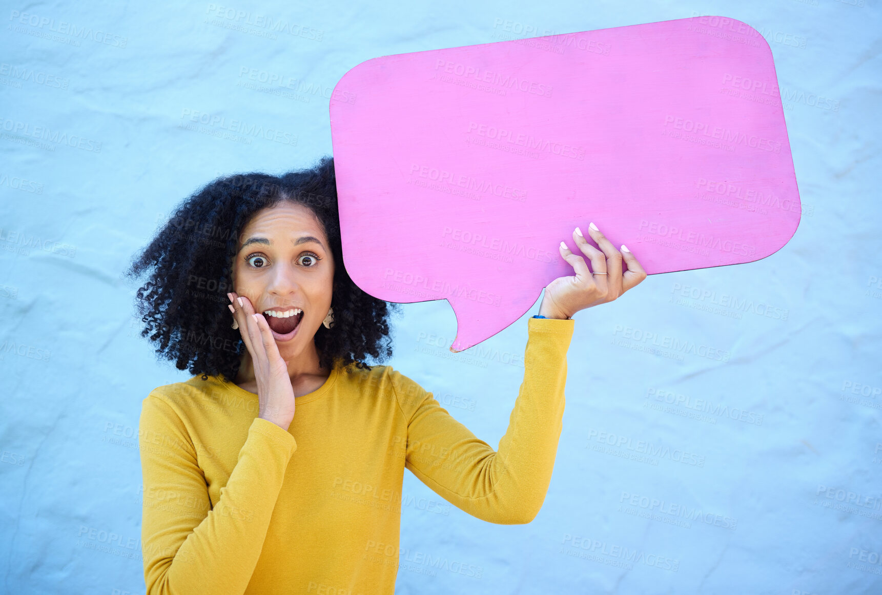 Buy stock photo Wow, portrait and black woman with speech bubble in studio for advertising, mockup on blue background. Face, omg and girl with billboard or poster on news, social media, or discount for shock sale