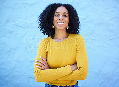 Buy stock photo Proud, portrait and black woman in studio on mockup, space and blue background for advertising. Face, smile and girl relax on backdrop, cheerful and confident, relax and posing inside on copy space