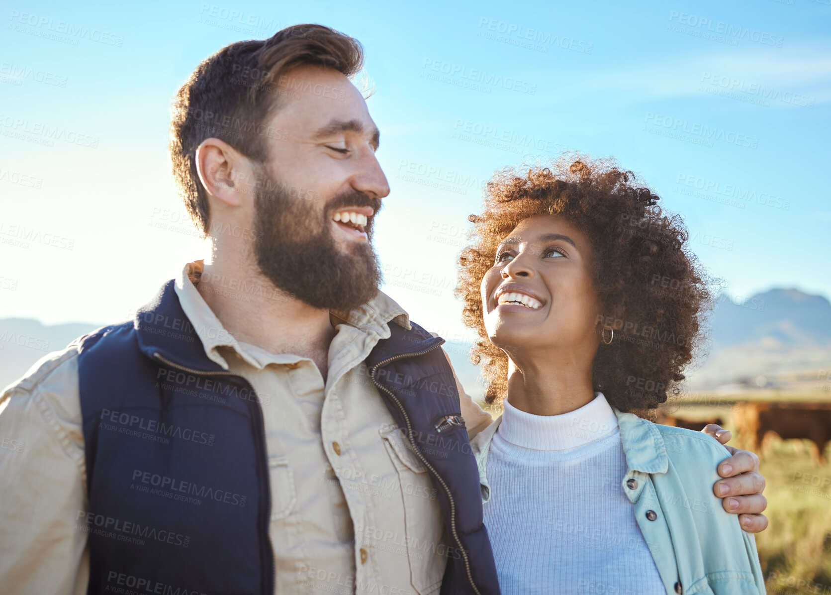 Buy stock photo Love, cow and smile with interracial couple on farm for agriculture, partnership and agro. Teamwork, animals and hug with man and black woman in grass field for sustainability, cattle and environment