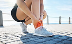Fitness, hands or runner with ankle pain at a beach after exercising, body training injury or outdoor workout. Red glow, or injured sports athlete suffering from broken foot after running exercise
