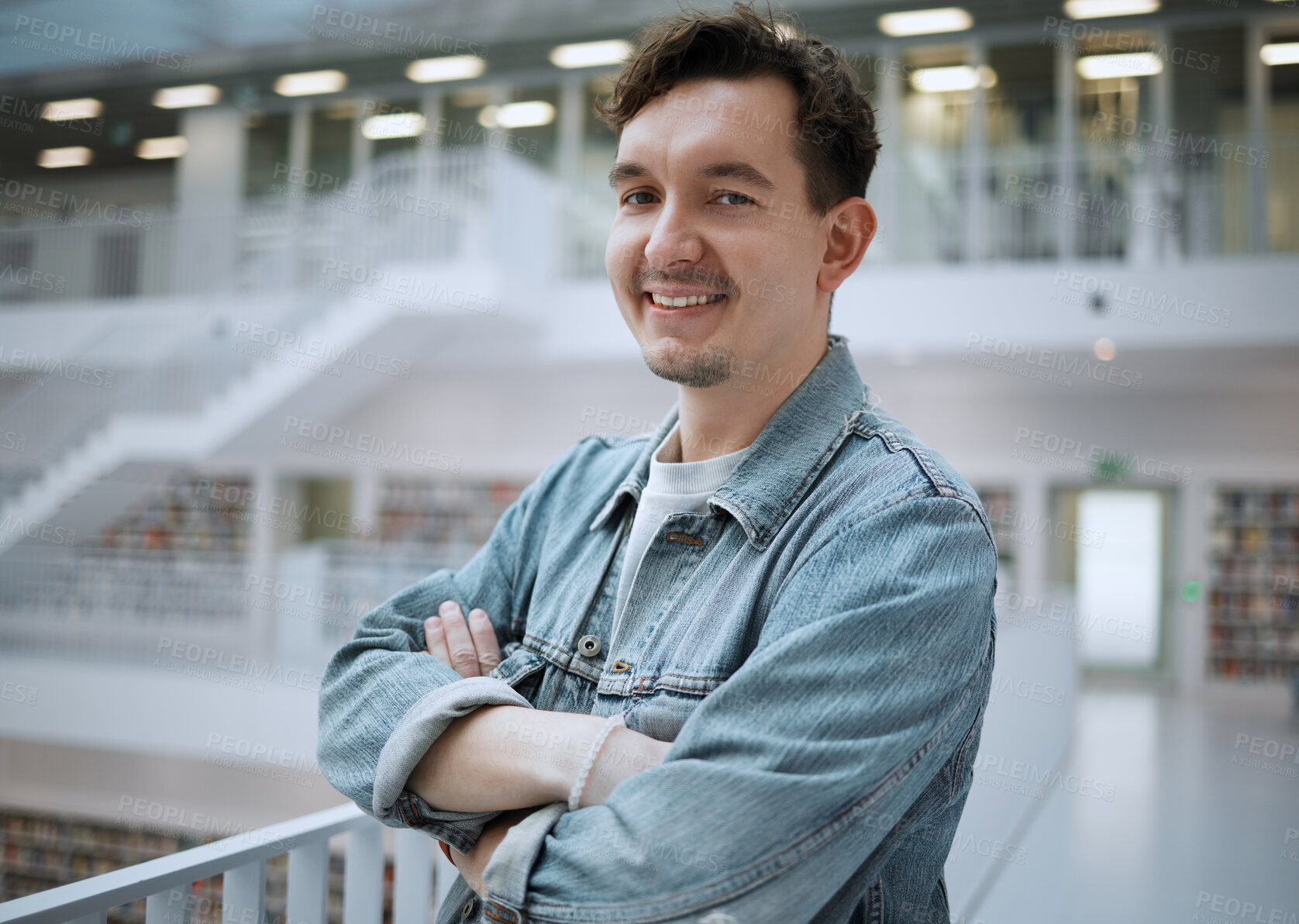 Buy stock photo College, knowledge and portrait of a man in a library for studying or learning for education. University, confidence and male student standing with crossed arms in a book store to work on school exam