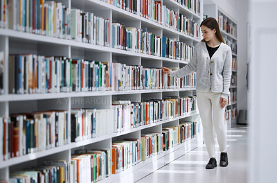 Buy stock photo Woman in library, student search for book and research project, reading with education and learning at university campus. Knowledge, story and fiction with textbook, study and browsing bookshelf