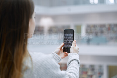 Buy stock photo Phone, photography and student in library for research update, social media post or content creation at university. Influencer woman or person with smartphone screen for live streaming campus design