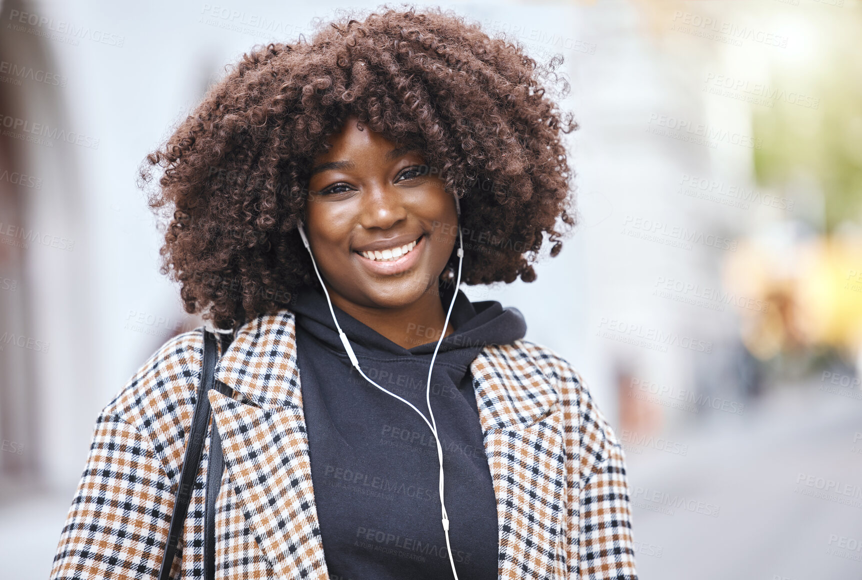 Buy stock photo Black woman, portrait and smile with earphones in city, urban town and Kenya. Happy plus size african female listening to music, radio and audio podcast with natural afro, happiness and relax outdoor