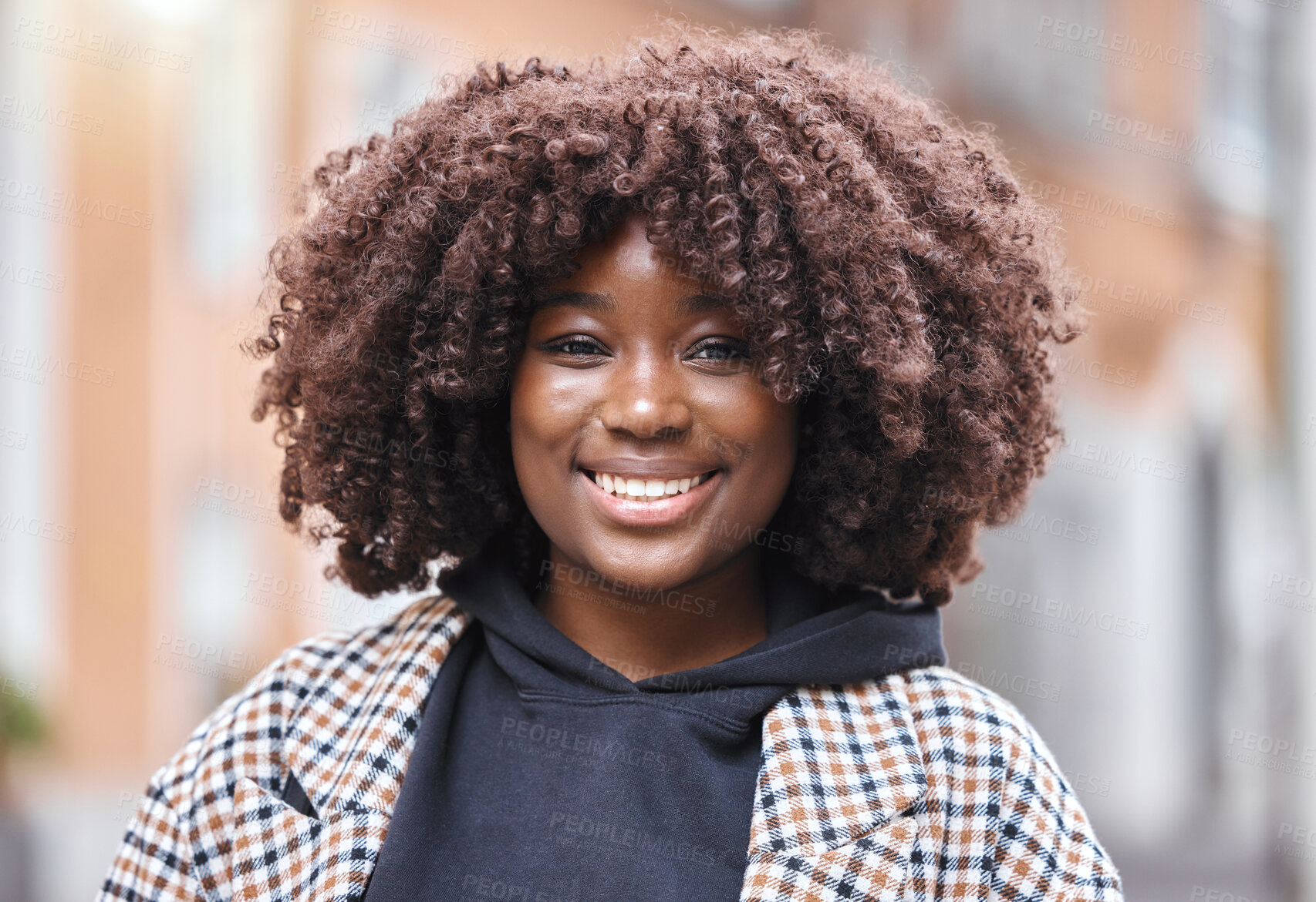 Buy stock photo Happy, smile and portrait of a black woman in the city with optimistic, good and positive mindset. Happiness, excited and face of African female with an afro standing in town while on holiday or trip