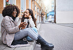 Friends, city and women with phone for social media, conversation and connection on London street. Communication, internet and happy black woman and girl on smartphone laugh for meme, website and app