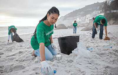 Buy stock photo Teamwork, cleaning and recycling with black woman on beach for sustainability, environment and eco friendly. Climate change, earth day and nature with volunteer and plastic for community service
