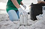 Recycle, volunteer hand cleaning beach and can in sand, picking up dirt at ocean on earth day. Community service, sustainability and environmental charity, people pick up trash for future of planet.