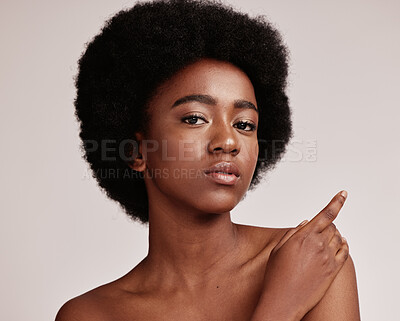 Buy stock photo Portrait, beauty or skin and a model black woman in studio on a gray background with afro hair. Skincare, cosmetics and natural with an attractive young female posing indoor for health or wellness