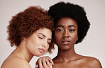 Skincare, beauty and friends, black women models with glowing skin and afro isolated on grey background. Dermatology, diversity and face, luxury cosmetics or makeup, woman model and friend in studio.