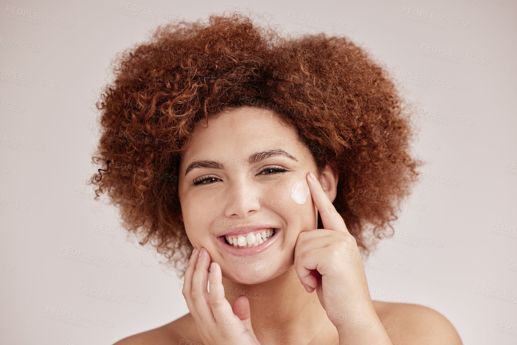 Buy stock photo Skincare, beauty and portrait of woman with cream on face, smile and afro, advertising luxury skin product promotion. Dermatology, cosmetics and facial for happy model isolated on studio background.