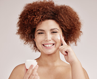 Buy stock photo Skincare, product and portrait of black woman with cream on face, smile and advertising luxury skin promotion. Dermatology, cosmetics and facial for happy model with jar isolated on studio background