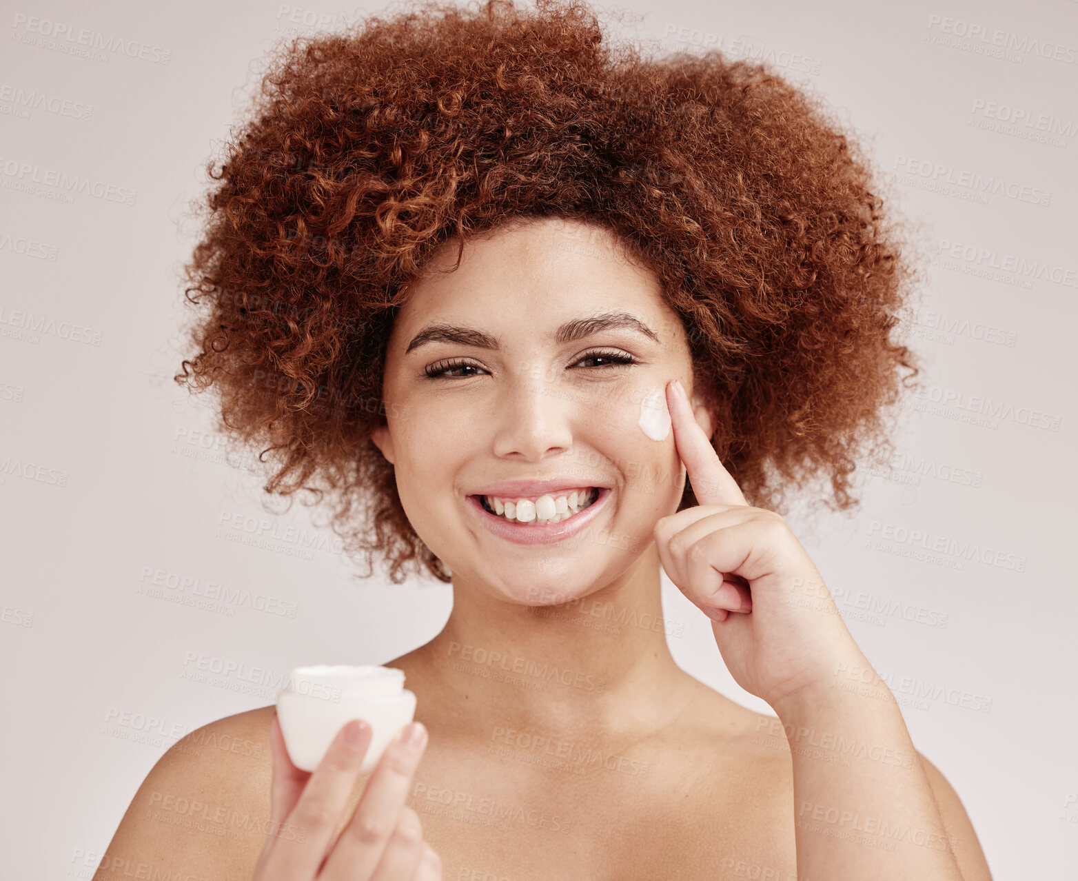 Buy stock photo Skincare, product and portrait of black woman with cream on face, smile and advertising luxury skin promotion. Dermatology, cosmetics and facial for happy model with jar isolated on studio background