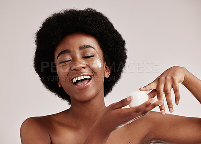 Buy stock photo Skincare, black woman with finger in cream and smile on face, afro and advertising luxury skin product promotion. Dermatology, cosmetics and facial beauty, happy model isolated on studio background.