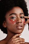 Skincare, eye or face mask portrait of black woman in studio with dermatology cosmetic product. Aesthetic model with hand on spa collagen beauty patch for health, wellness and natural facial glow