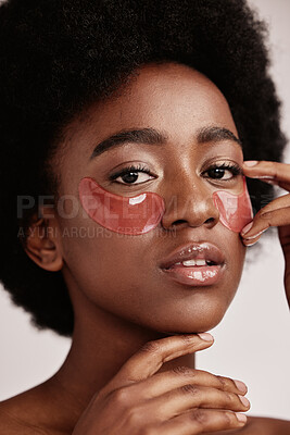 Buy stock photo Skincare, eye or face mask portrait of black woman in studio with dermatology cosmetic product. Aesthetic model with hand on spa collagen beauty patch for health, wellness and natural facial glow