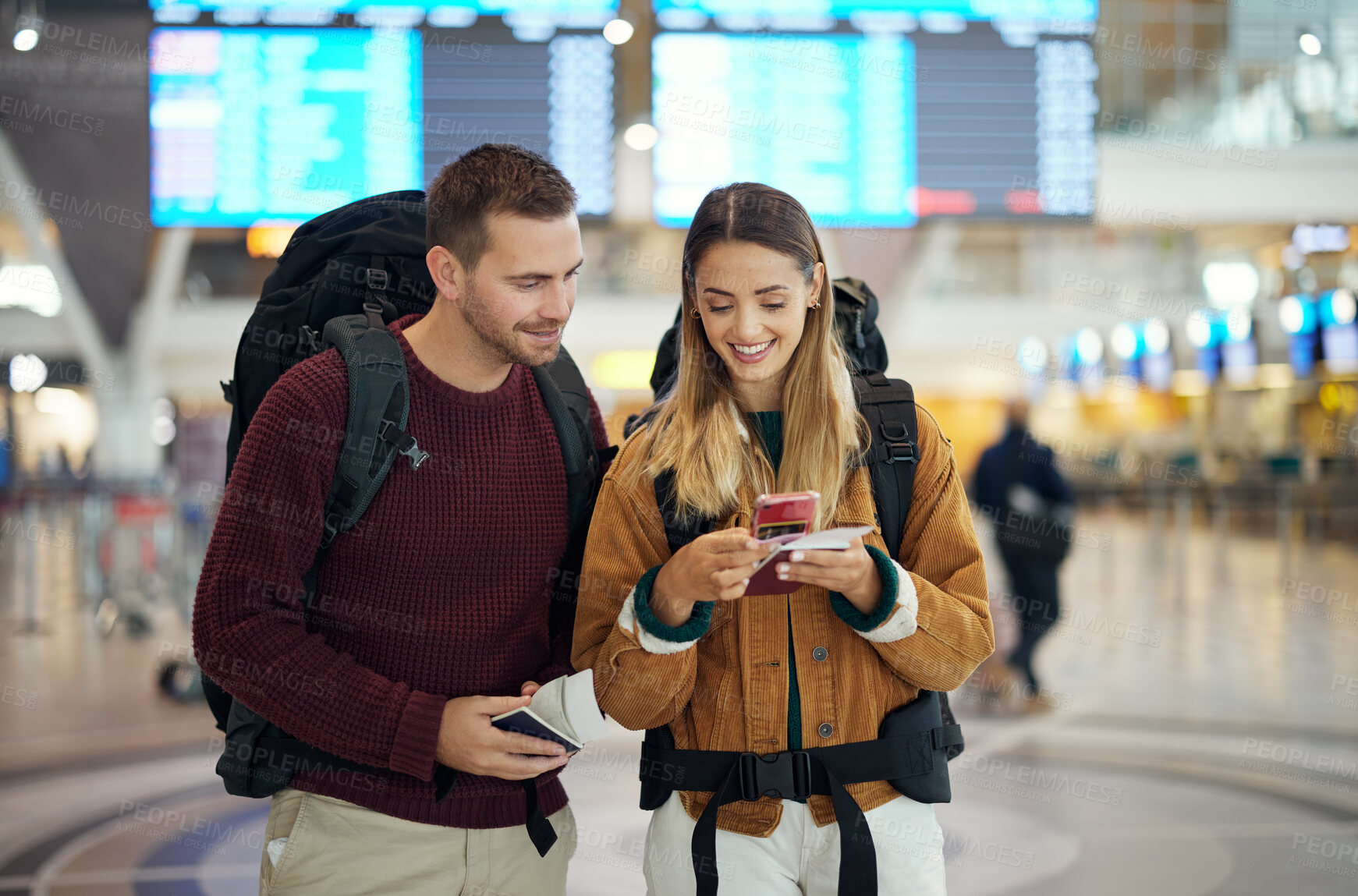 Buy stock photo Happy couple, airport and phone with ticket, travel app and adventure with excited face, conversation and smile. Man, woman and smartphone for digital booking of hotel, taxi or bus for transportation