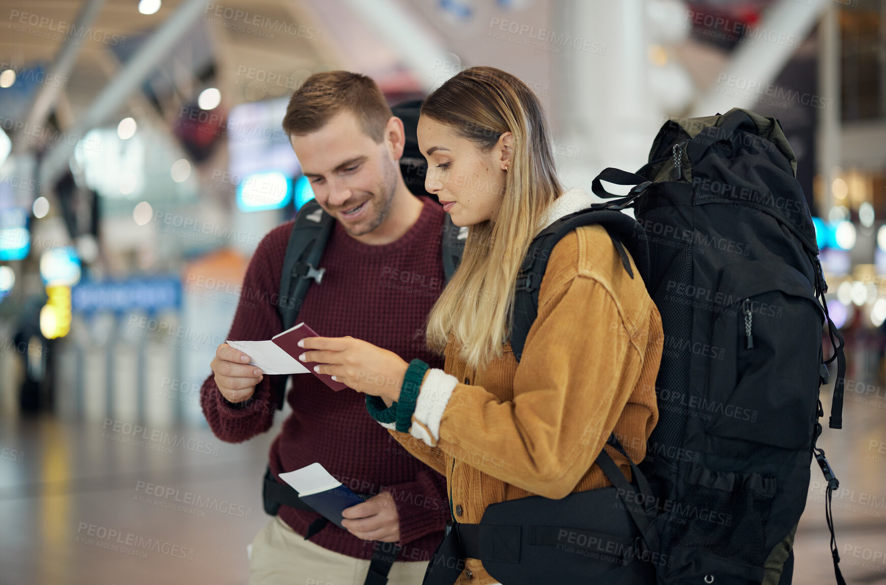 Buy stock photo Couple, airport and checking passport for travel, backpacking or journey excited for vacation together. Happy man and woman looking at ID documents ready for traveling, information or airline trip