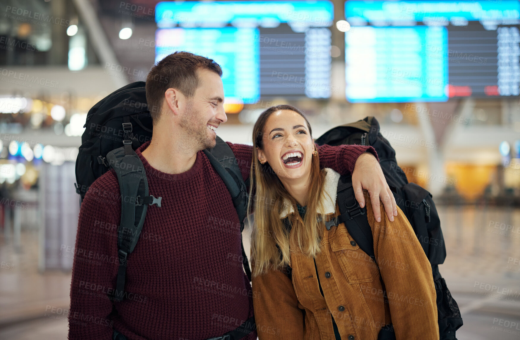 Buy stock photo Travel, hug and couple at airport talking, chatting or laughing at comic or funny joke. Valentines love, thinking and happy man and woman in airline lobby waiting for flight departure for vacation.