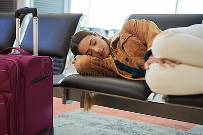 Buy stock photo Tired, sleeping and woman at airport, waiting and bench for travel, international transport and flight delay. Tourist nap on chair at airplane lounge before journey with baggage, luggage and suitcase