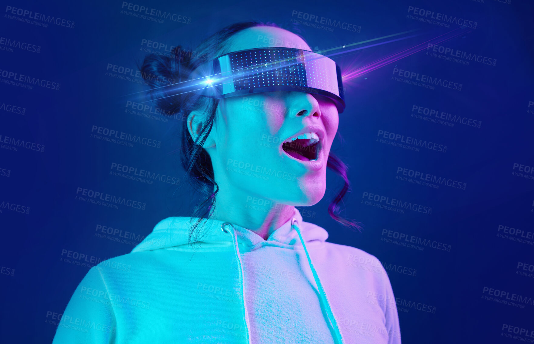 Buy stock photo Metaverse, headset and shocked woman in a virtual reality in studio for futuristic innovation technology. Digital simulation, gaming and female with vr goggles for cyber tech by dark blue background.