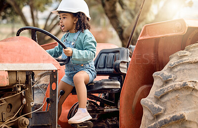Buy stock photo Girl kid in tractor, agriculture and farming transport, sustainability and learning field work with development and fun. Childhood, farm machinery and farmer in training with growth and young child