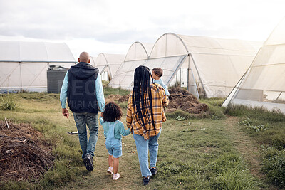 Buy stock photo Farmer family walk, people holding hands on farm and agriculture, mother and father with children back view. Sustainability in countryside, parents and kids farming together outdoor with agro

