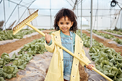 Buy stock photo Kid, girl or portrait and farming tool in greenhouse, agriculture land or sustainability field for harvesting. Smile, happy or gardening kid and farmer equipment for soil, lettuce or vegetable growth