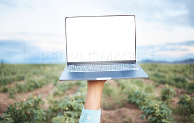 Buy stock photo Farm, agriculture and sustainability with a laptop in the hand of a farmer outdoor in a crop field during the harvest season. Farming, agricultural and sustainable research with a computer outside