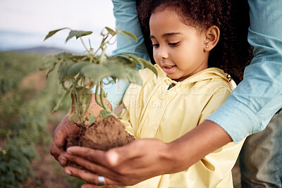 Buy stock photo Nature, sustainable and child with a plant on farm for planting eco friendly, organic and green leaves. Agriculture, farming and young agro girl kid holding soil and greenery in field in countryside.